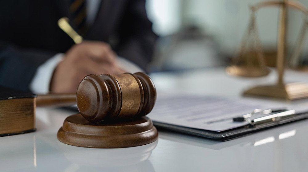 Judge gives hammer and lawyer in suit working on documents Law, advice and justice in office or courtroom, legal advisor with hammer and scales, law, justice concept